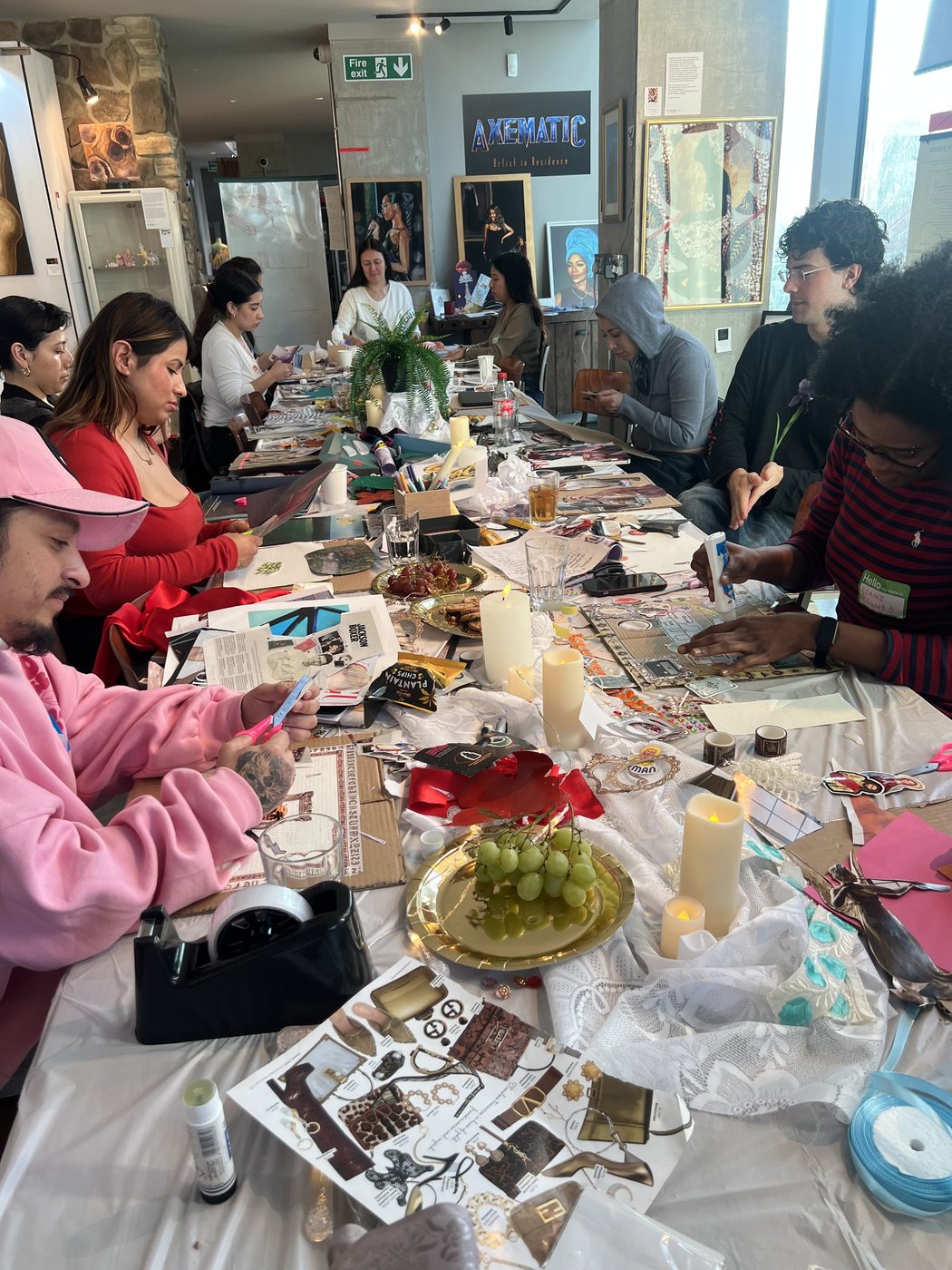 The Collage Club workshop, participants making collages at a shared table